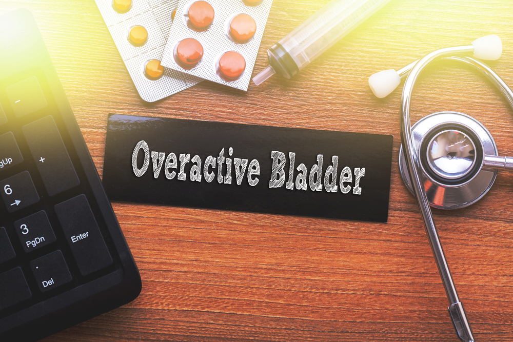 sign saying "overactive bladder" on a desk.