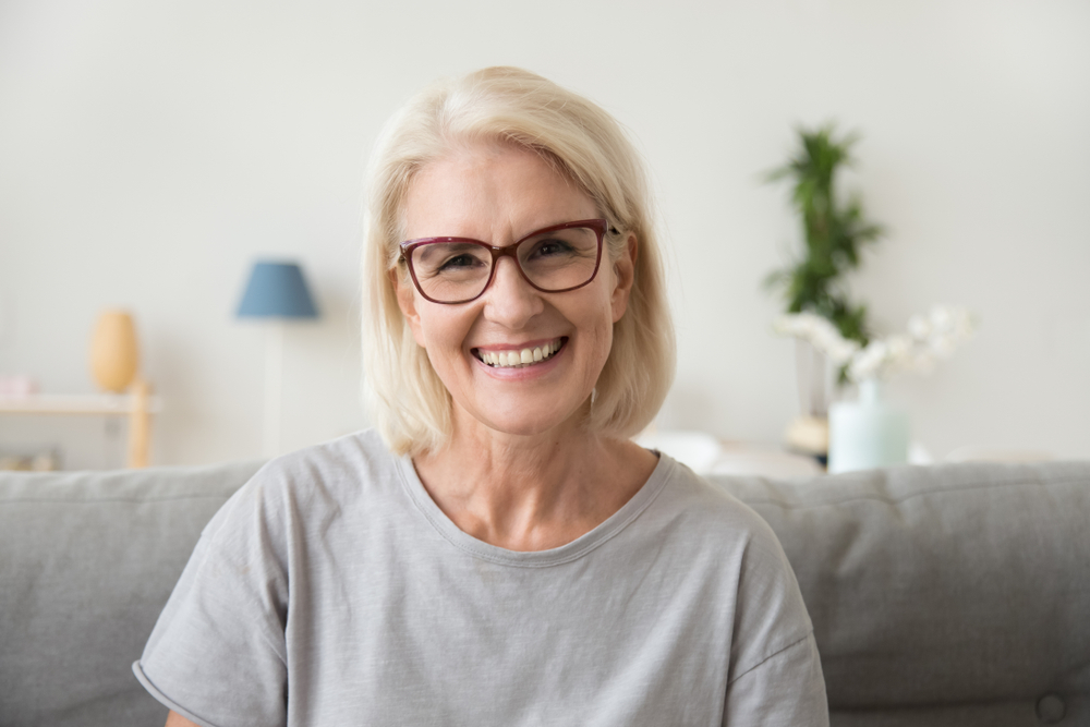 Middle-aged woman smiling.